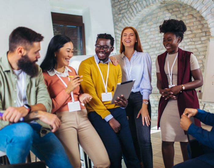 Employees standing and smiling