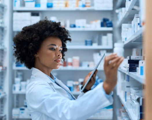Female pharmacist reviewing prescriptions